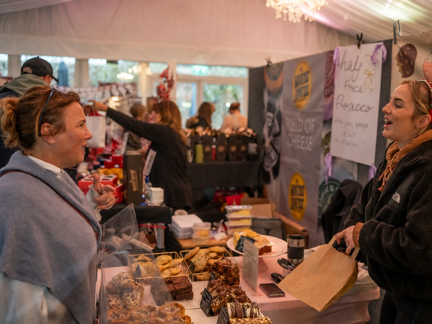 Christmas fair visitor buying from an independent food stall